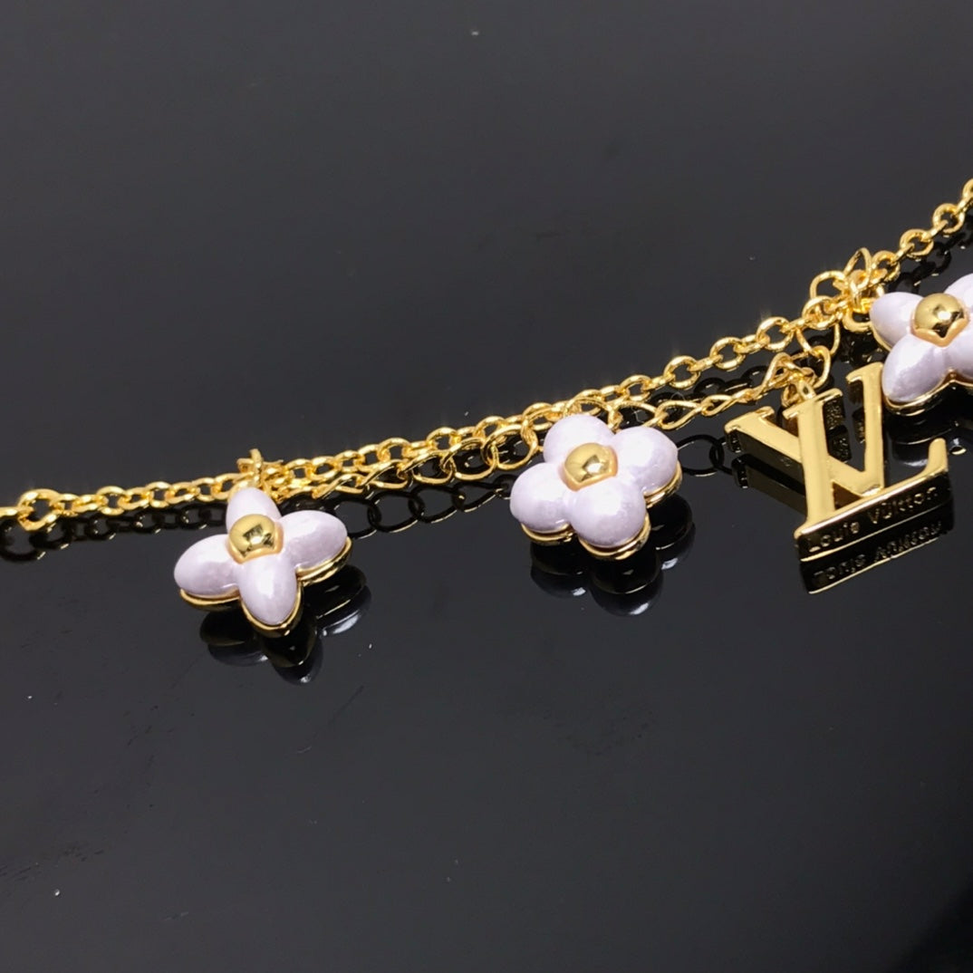 [Everoly JW]LOGO 6 MOTIF STAR AND SUN GOLD BRACELET
